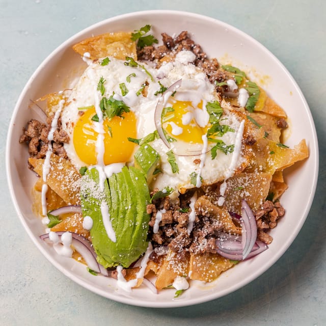 Chilaquiles Rojos / Verdes (Red / Green Sauce Tortilla Chips).